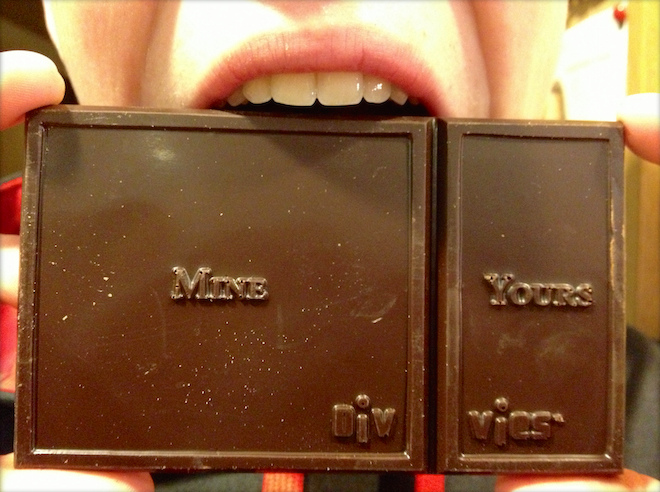 Photograph of a chocolate bar divided into a large piece labeled "Mine" and a smaller piece labeled "Yours"