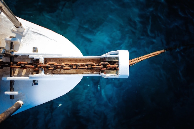 Photograph of ship's prow at anchor