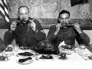Servicemen eating a Thanksgiving dinner after the end of World War I (1918)