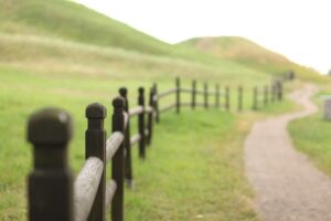 A fenced path through the hills