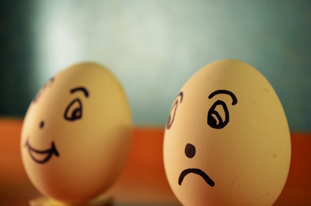 Sad egg face vs. happy egg face.