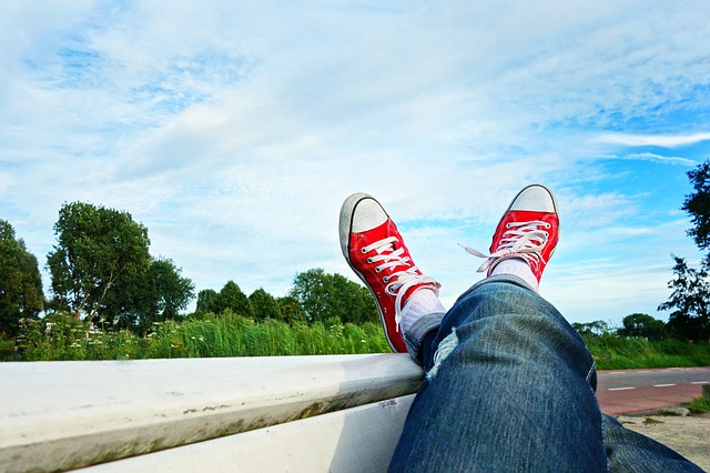 Relaxing outside with your feet propped up.