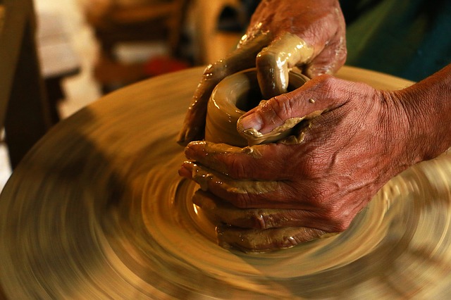 Clay being shaped on a potter's wheel.