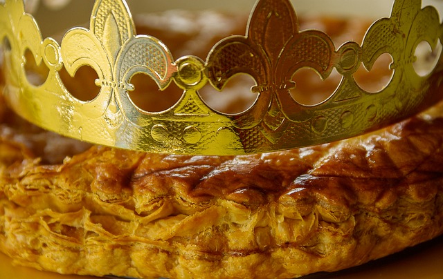 A crown a top a pastry to represent a "king cake".
