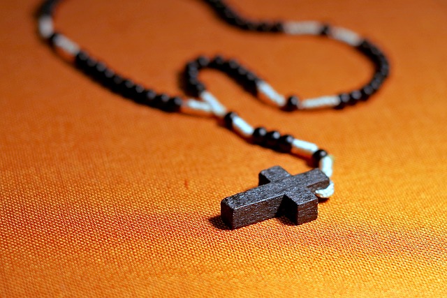 A cross on a necklace.