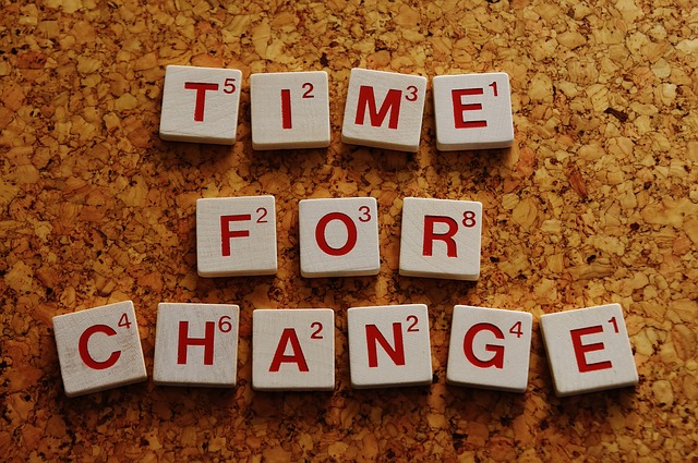 Time for Change spelled out with letter tiles.