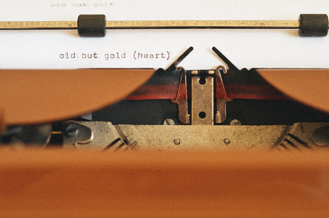 A typewriter typing the words 'old but gold (heart)' as a true love story from God.