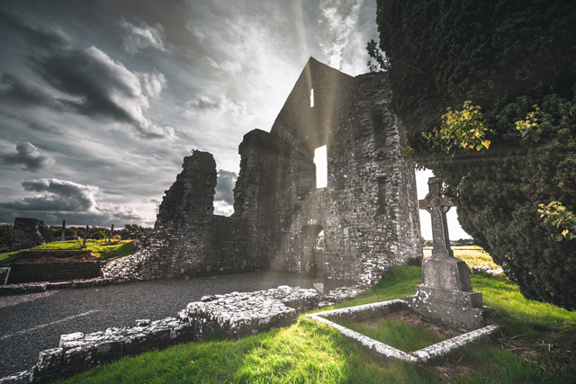 Sunlight shining through the ruins of an old Irish church.