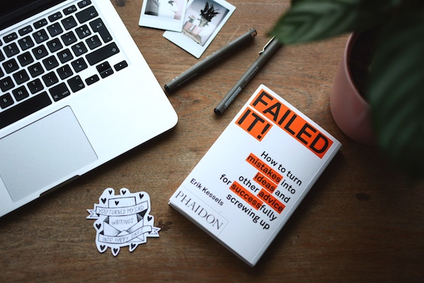 Items on a desk that remind of recent failures.