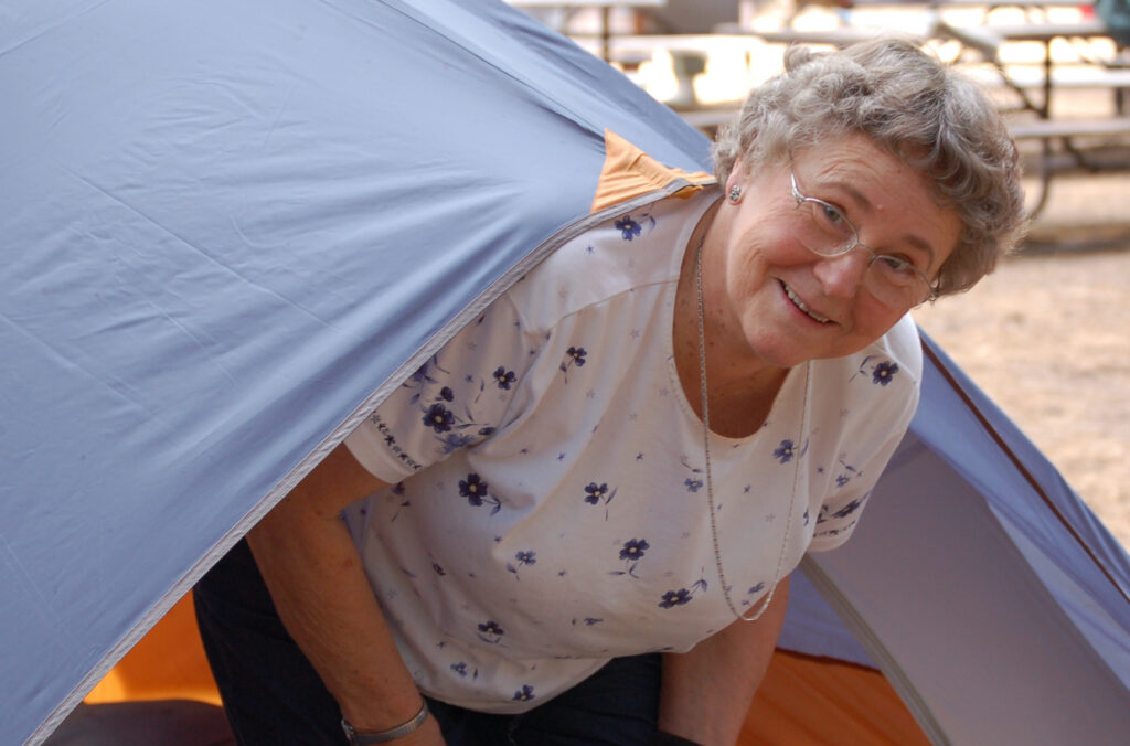 Mark Roberts' mom coming out of a tent