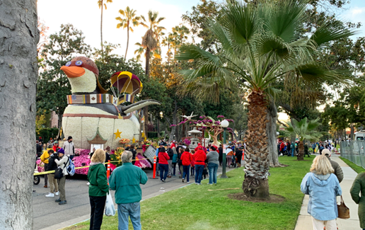 People watching floats pass by in the Rose Parade in Pasadena